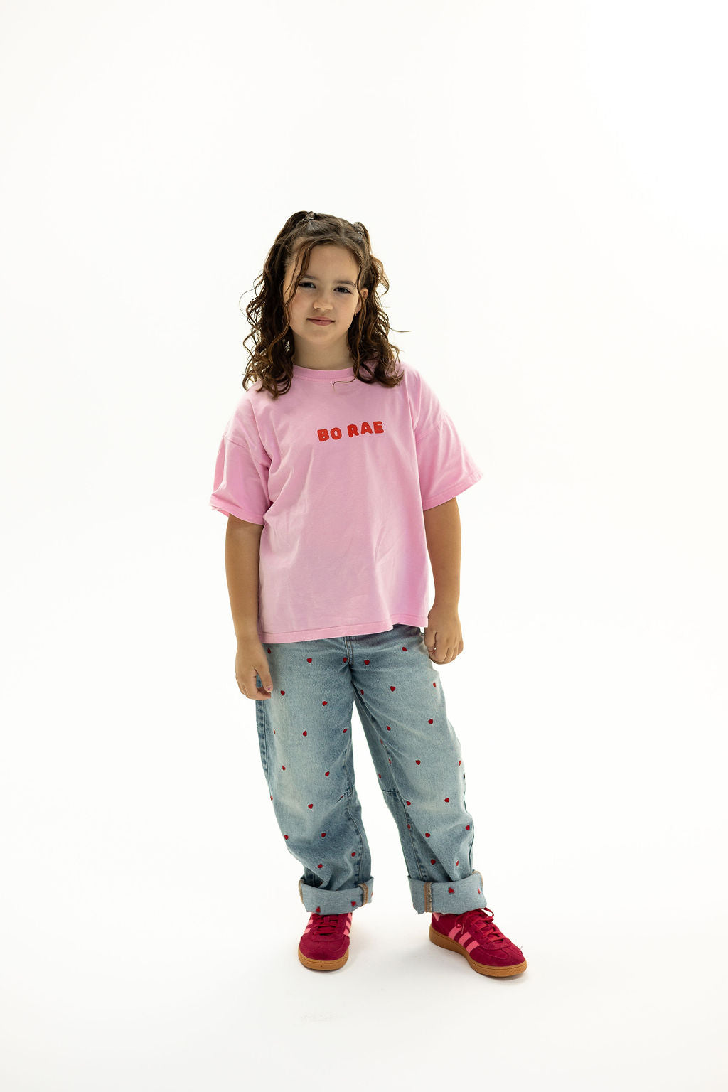 BO RAE How Lucky Are We oversized kids T-shirt in pink, front view with red chest logo