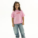 BO RAE How Lucky Are We oversized kids T-shirt in pink, front view with red chest logo