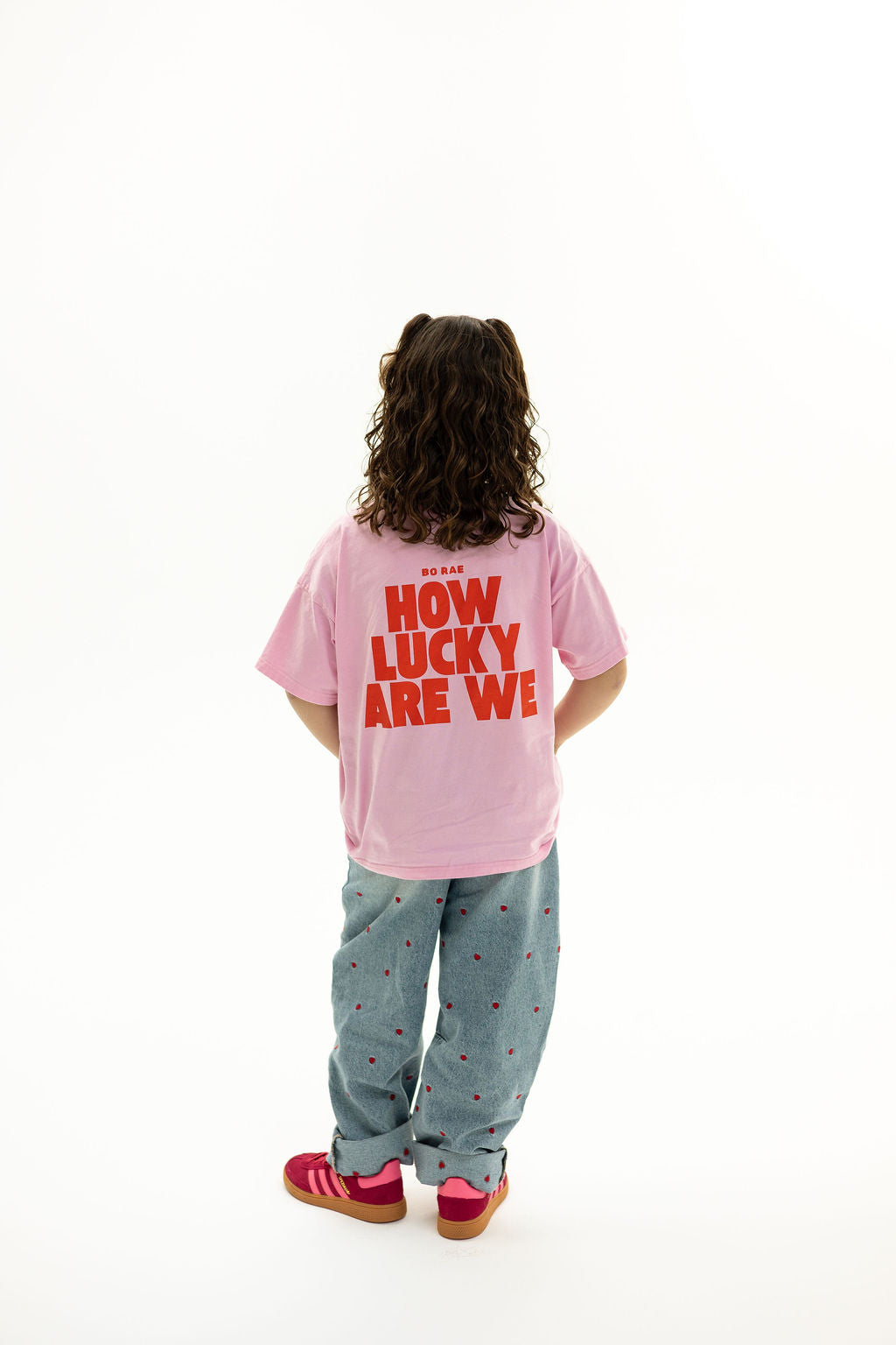 BO RAE How Lucky Are We oversized kids T-shirt in pink, back view featuring large red graphic print