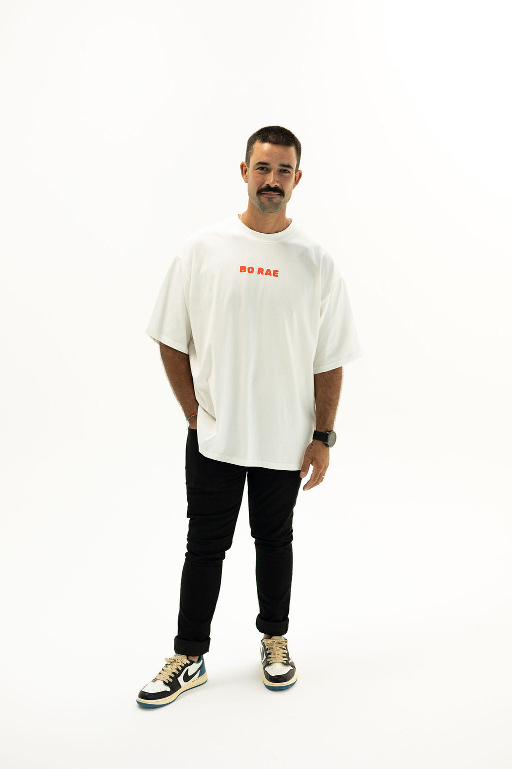 Front view of BO RAE How Lucky Are We oversized unisex adult T-shirt in white with Red chest logo