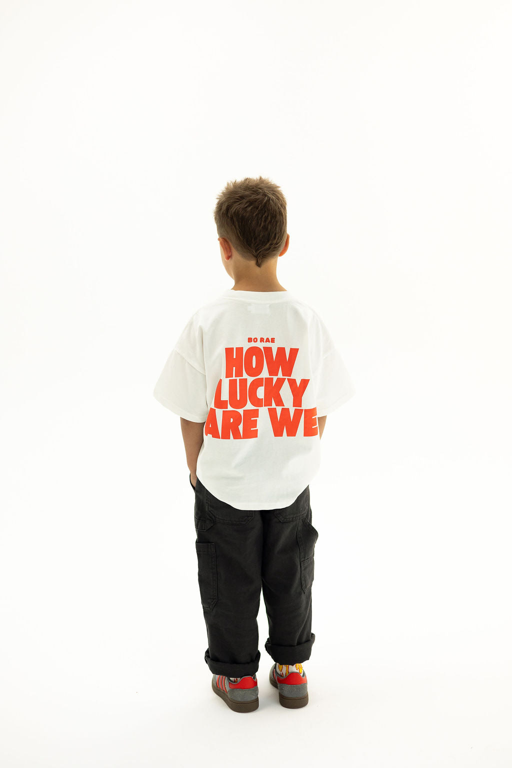 BO RAE How Lucky Are We oversized kids T-shirt in white, back view featuring large red graphic print.
