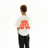 BO RAE How Lucky Are We oversized kids T-shirt in white, back view featuring large red graphic print.