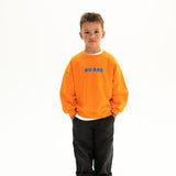 BO RAE How Lucky Are We oversized kids jumper in orange, front view with blue chest logo.