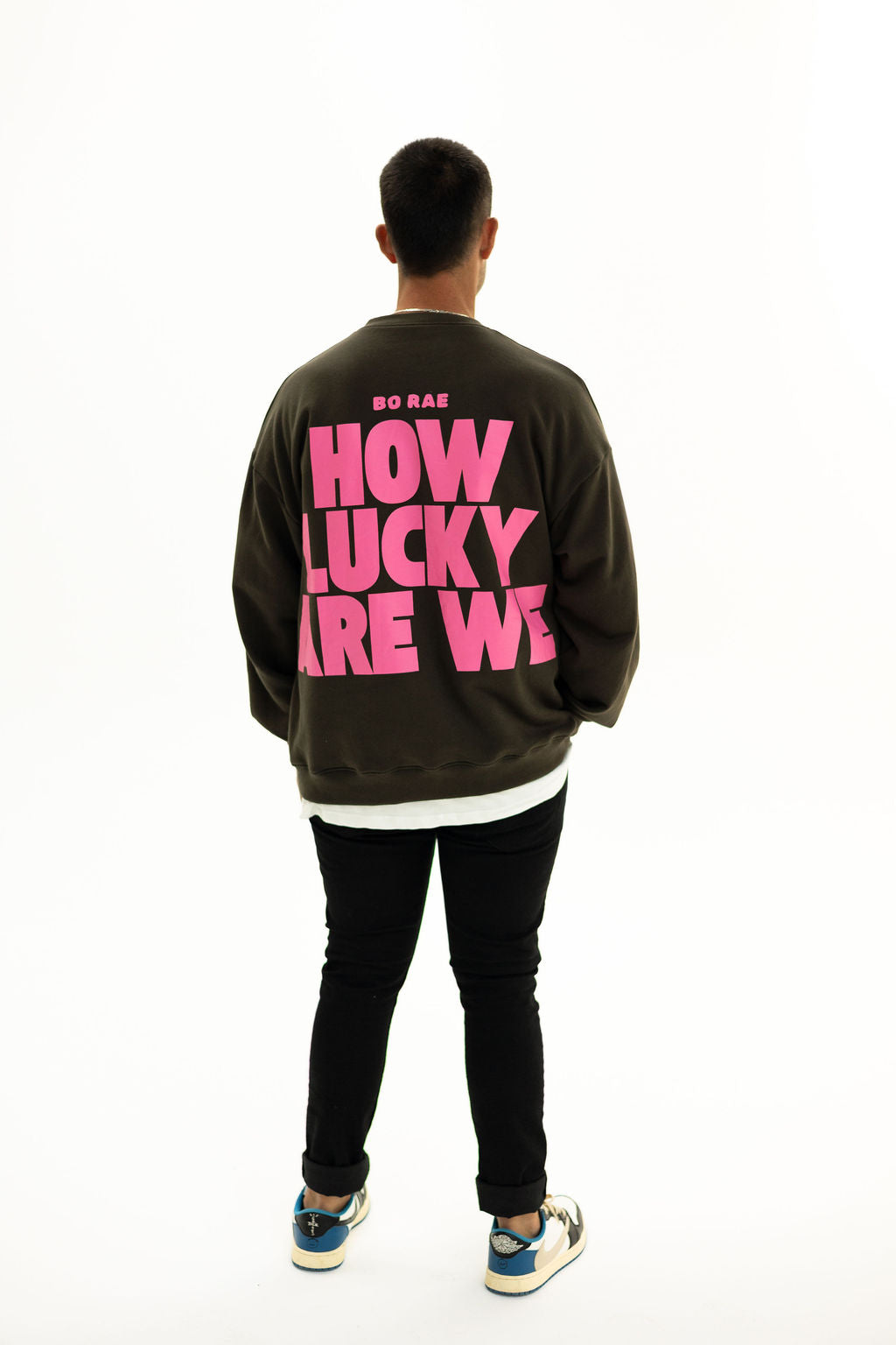Back of BO RAE How Lucky Are We oversized unisex adult jumper in Khaki Slate Grey featuring large pink graphic print