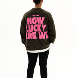 Back of BO RAE How Lucky Are We oversized unisex adult jumper in Khaki Slate Grey featuring large pink graphic print